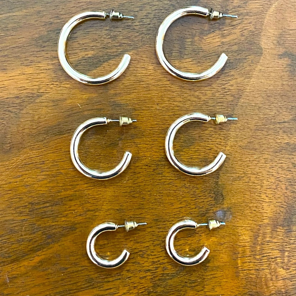 Three sizes of chunky yellow gold looking hoops